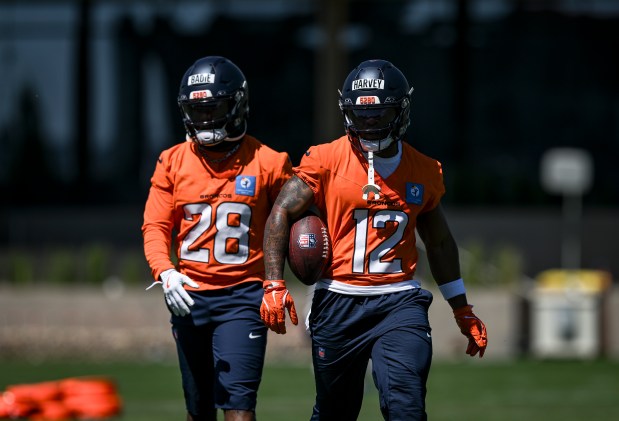 Tyler Badie (28) and RJ Harvey (12) of the Denver Broncos work out with teammates during OTAs at the Broncos Park in Centennial, Colorado on Thursday, June 4, 2026. (Photo by AAron Ontiveroz/The Denver Post)