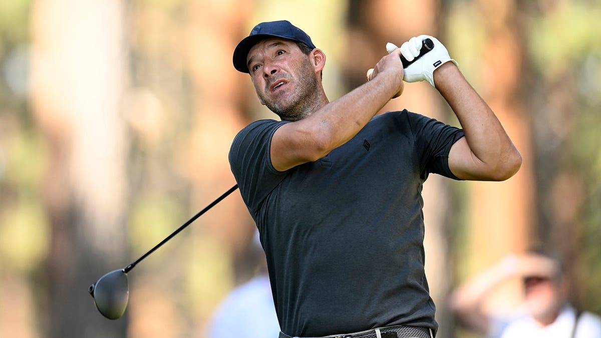 Tony Romo playing a golf shot from the tee box