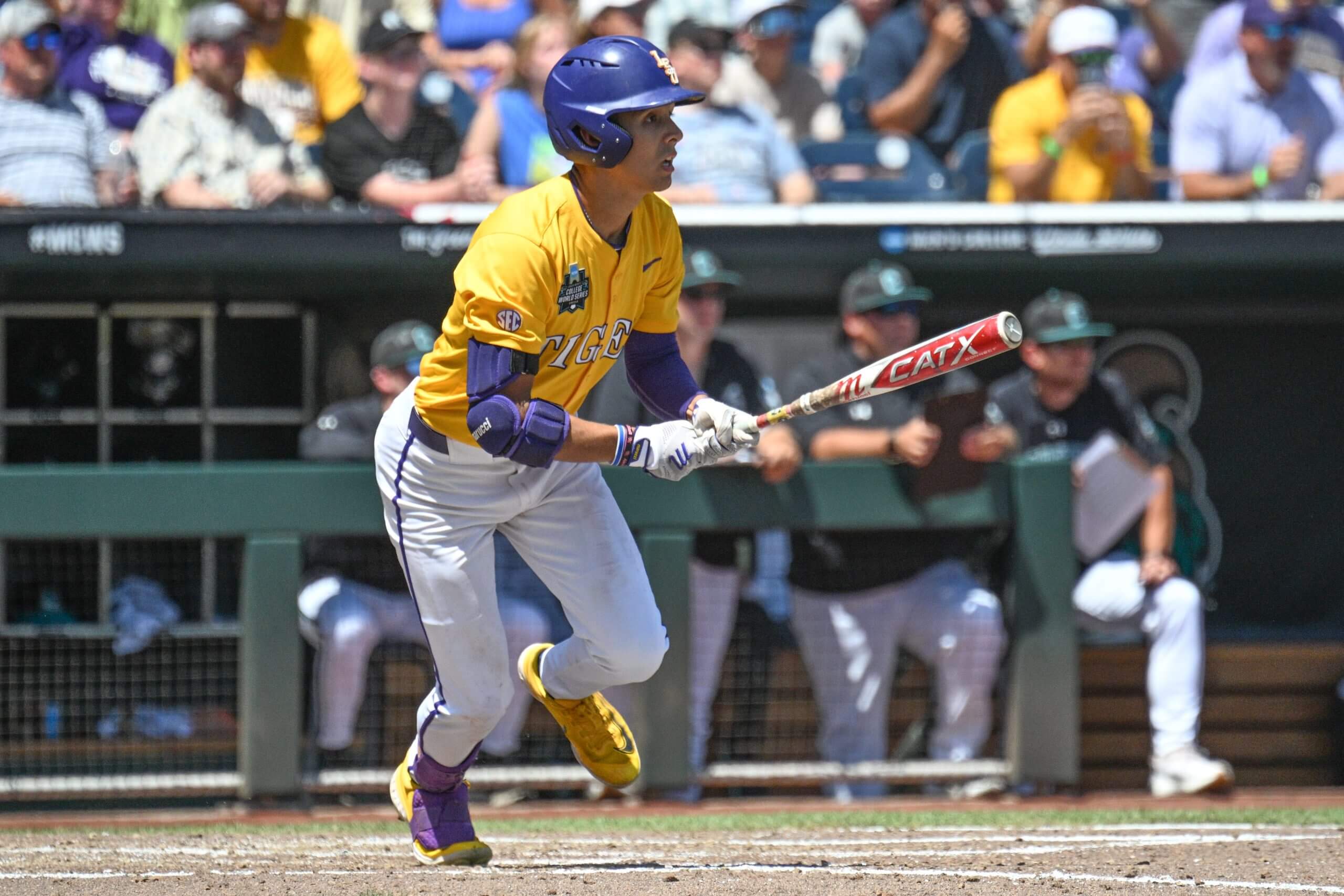LSU Tigers left fielder Derek Curiel (6) drives in two runs with a single against the Coastal Carolina Chanticleers during the fourth inning at Charles Schwab Field.