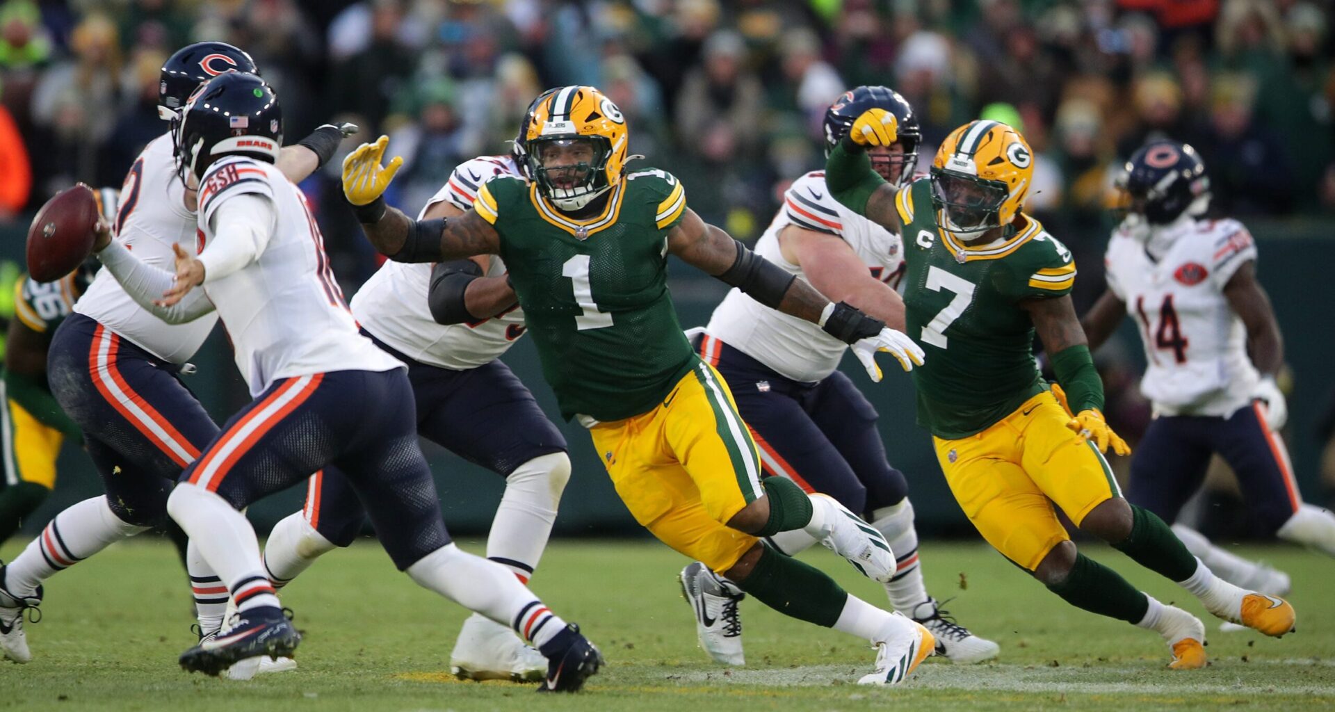 Green Bay Packers defensive end Micah Parsons (1) and linebacker Quay Walker (7) pressure Chicago Bears quarterback Caleb Williams (18) on Sunday, December 7, 2025, at Lambeau Field in Green Bay, Wis. The Packers defeated the Bears 28-21.