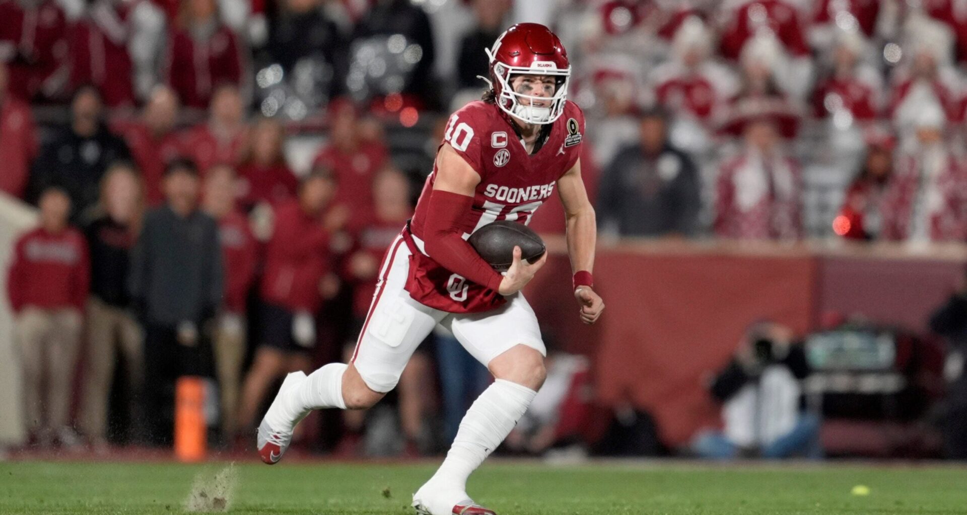 Oklahoma Sooners quarterback John Mateer (10) carries the ball during a first-round College Football Playoff game between the University of Oklahoma Sooners (OU) and the Alabama Crimson Tide at Gaylord Family - Oklahoma Memorial Stadium in Norman, Okla., Friday, Dec. 19, 2025. Alabama won 34-24.