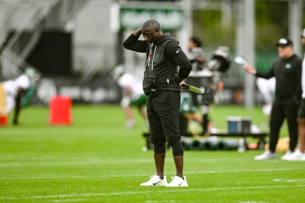 New York Jets head coach Aaron Glenn looking on during training camp.