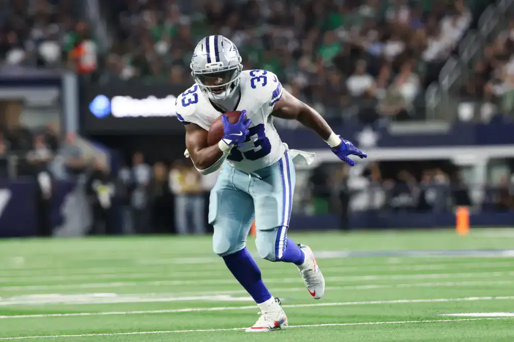 Javonte Williams running the football as a Dallas Cowboys as fans wonder who will emerge as running back two from training camp.
