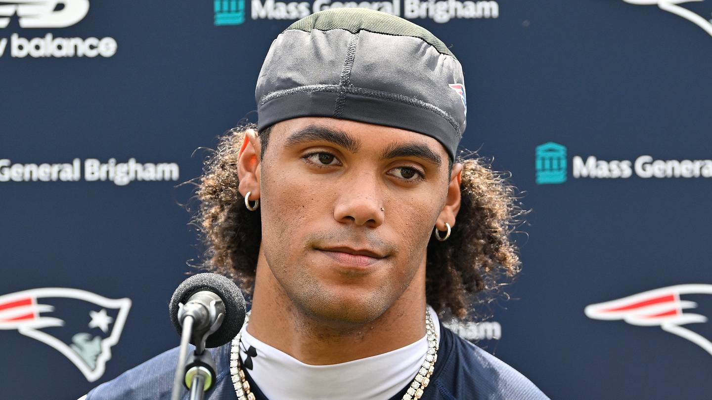 New England Patriots cornerback Christian Gonzalez (0) speaks to the media.