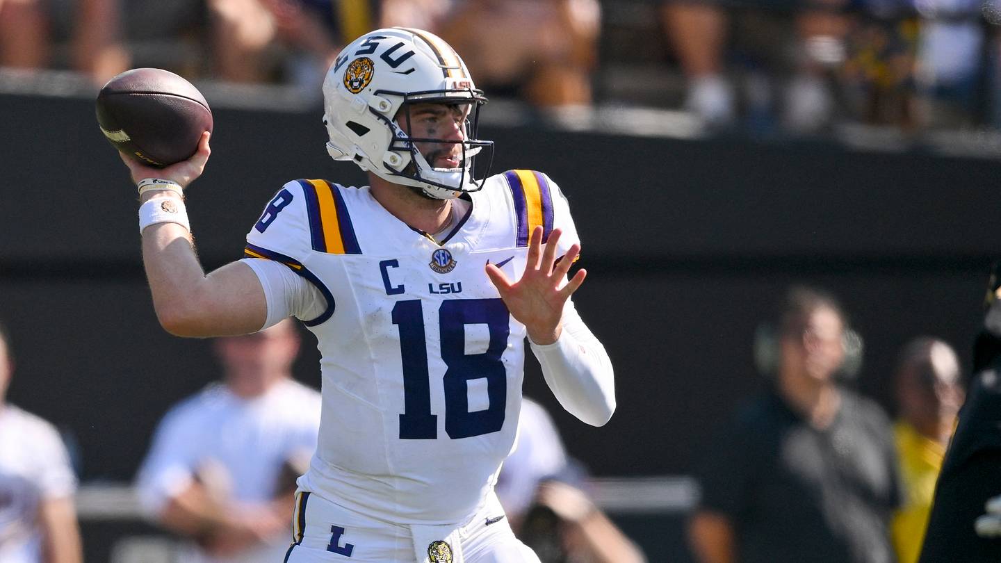 Oct 18, 2025; Nashville, Tennessee, USA;  Louisiana State Tigers quarterback Garrett Nussmeier (18) stands in the pocket against the Vanderbilt Commodores during the first half at FirstBank Stadium. Mandatory Credit: Steve Roberts-Imagn Images