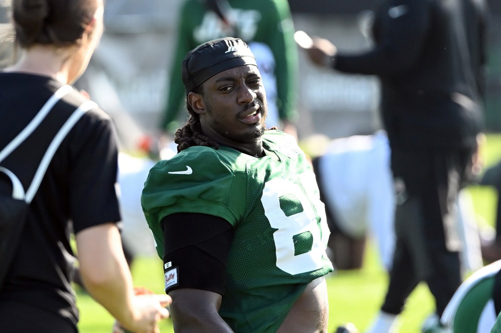 Jelani Woods stretches during practice at training camp in Florham Park, NJ.