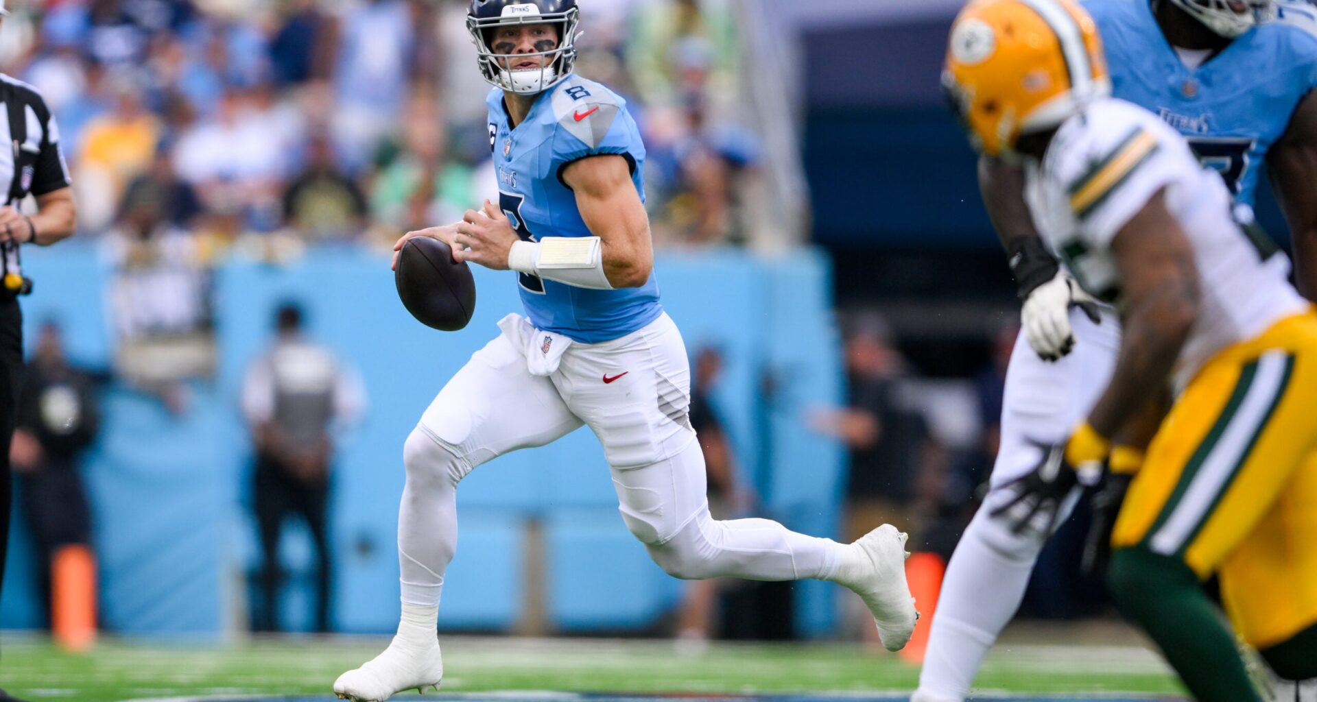 Sep 22, 2024; Nashville, Tennessee, USA; Tennessee Titans Will Levis (8) scrambles against the Green Bay Packers during the first half at Nissan Stadium.