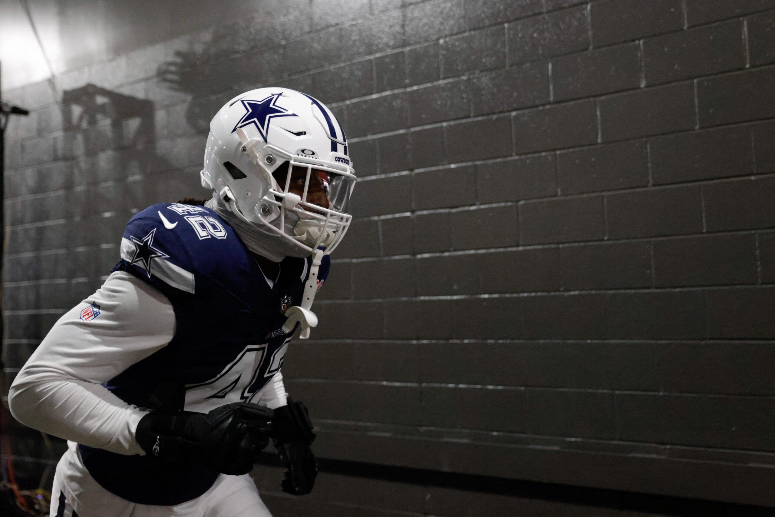 Dec 25, 2025; Landover, Maryland, USA; Dallas Cowboys defensive end Jadeveon Clowney (42) runs onto the field prior to the game against the Washington Commanders at Northwest Stadium.