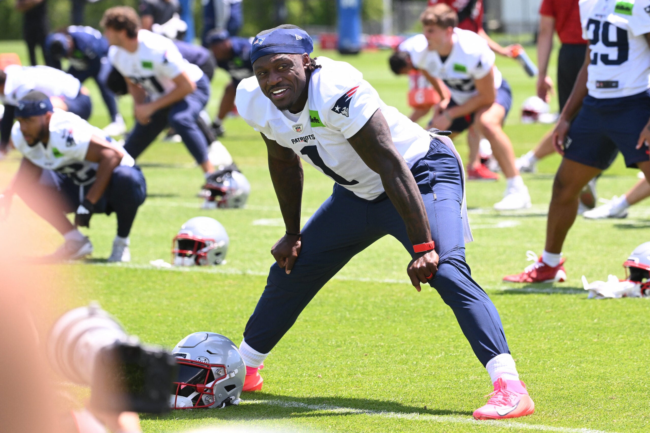 Jun 2, 2026; Foxborough, MA, USA; New England Patriots wide receiver A.J. Brown (1) warms up during the team's OTA at Gillette Stadium.