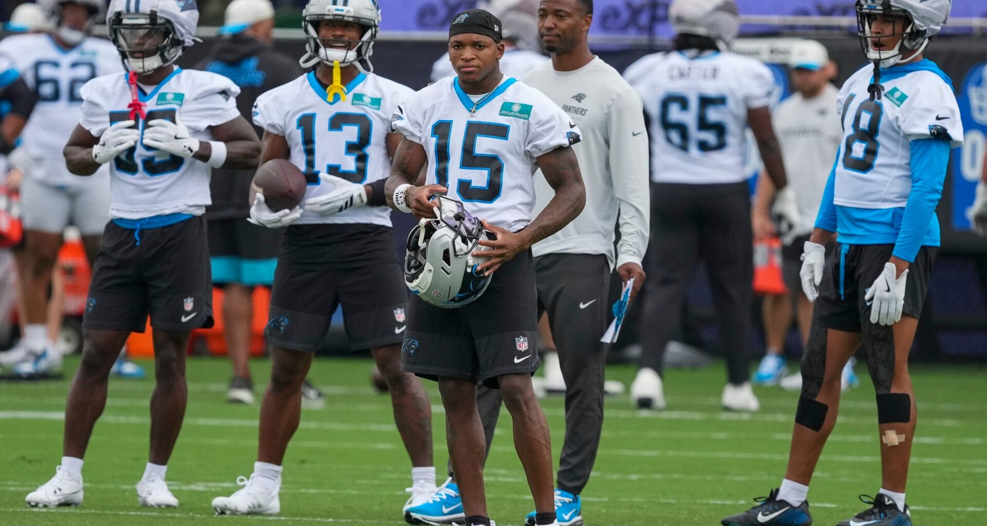 Aug 4, 2026; Charlotte, NC, USA; Carolina Panthers wide receiver Jimmy Horn Jr. (15) and receivers during training camp at Bank of America Stadium.
