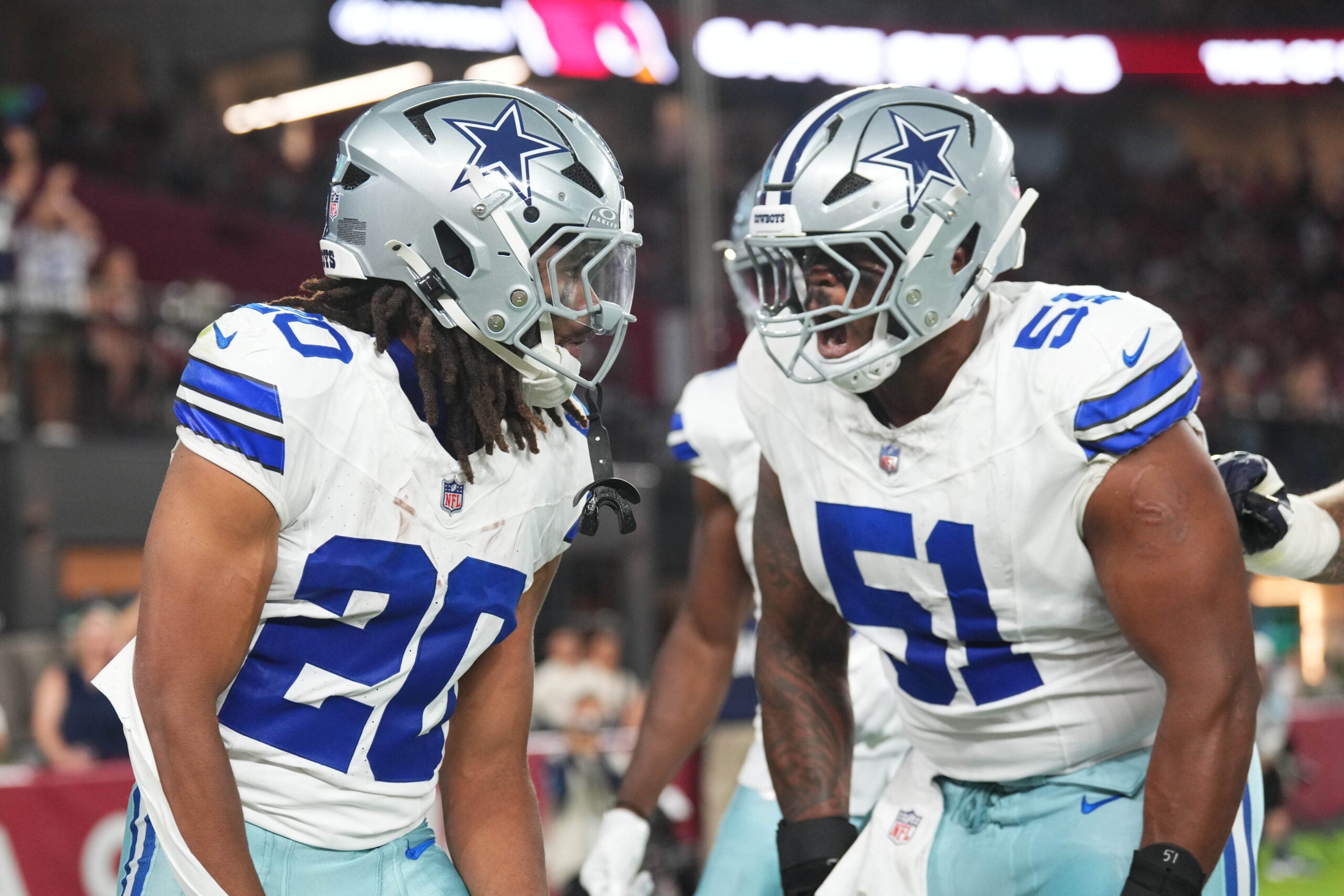 Aug 22, 2026; Glendale, Arizona, USA; Dallas Cowboys running back Malik Davis (20) celebrates his touchdown with Dallas Cowboys guard Nick Leverett (51) against the Arizona Cardinals during the first half at State Farm Stadium.