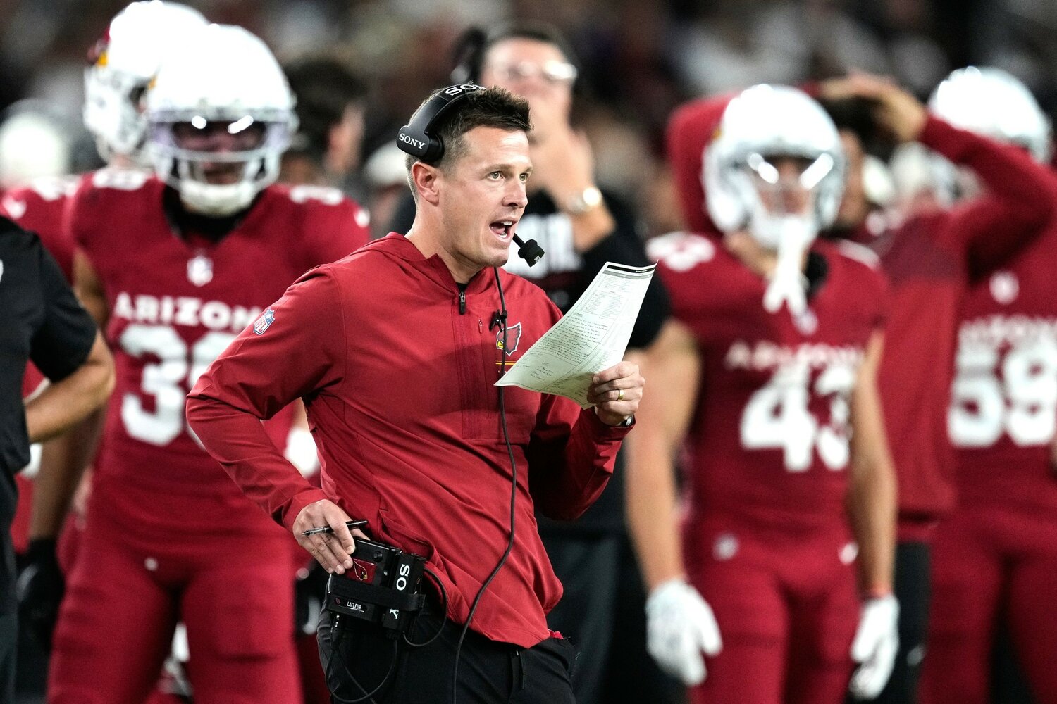 Arizona Cardinals head coach Mike LaFleur makes a call in the first half of a preseason NFL football game against the Dallas Cowboys Saturday, Aug. 22, 2026 in Glendale.