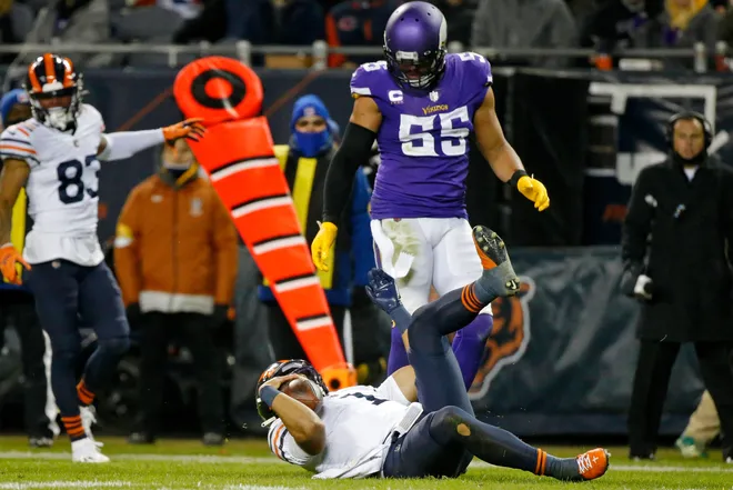 Minnesota Vikings outside linebacker Anthony Barr (55) watches Chicago Bears quarterback Justin Fields (1) after he got hit in the helmet by Minnesota Vikings middle linebacker Eric Kendricks (not pictured) during the second half at Soldier Field.