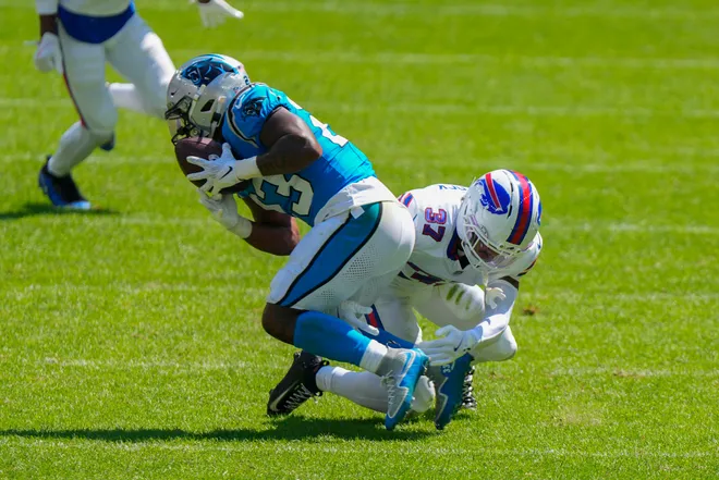 Aug 15, 2026; Orchard Park, New York, USA; Carolina Panthers running back Trevor Etienne (23) makes a catch and is tackled by Buffalo Bills cornerback Jordan Hancock (37) during the second half at New Highmark Stadium. Mandatory Credit: Gregory Fisher-Imagn Images