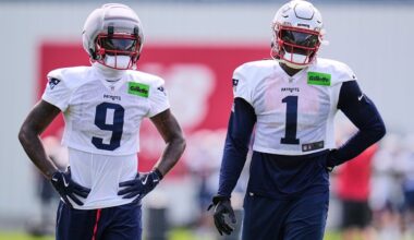 New England Patriots wide receivers A.J. Brown (1) and Kayshon Boutte (9) wait their turn on a drill during the team's NFL football training camp, Monday, Aug. 10, 2026, in Foxborough, Mass. (AP Photo/Charles Krupa)