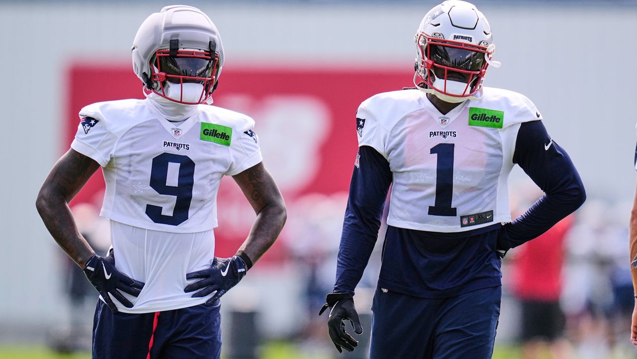 New England Patriots wide receivers A.J. Brown (1) and Kayshon Boutte (9) wait their turn on a drill during the team's NFL football training camp, Monday, Aug. 10, 2026, in Foxborough, Mass. (AP Photo/Charles Krupa)