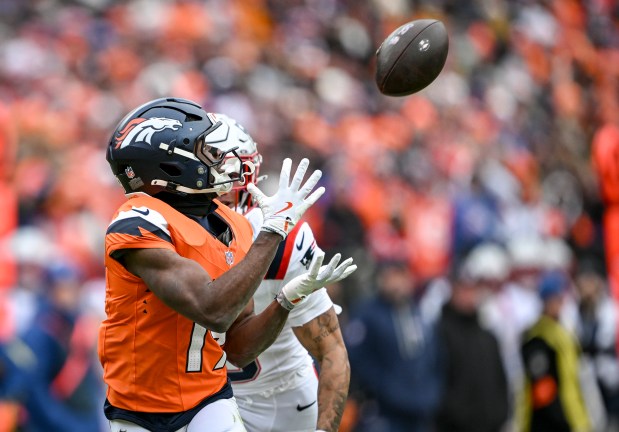 Marvin Mims Jr. (19) of the Denver Broncos beats Christian Gonzalez (0) of the New England Patriots for a deep reception during the first quarter at Empower Field at Mile High in Denver, Colorado on Sunday, Jan. 25, 2026. (Photo by AAron Ontiveroz/The Denver Post)