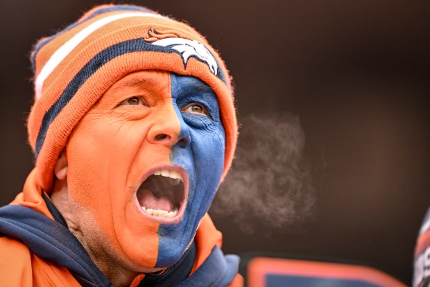 DENVER , CO - JANUARY 25: A Denver Broncos fan cheers his team on against the New England Patriots during the second quarter at Empower Field at Mile High in Denver, Colorado on Sunday, January 25, 2026. (Photo by AAron Ontiveroz/The Denver Post)