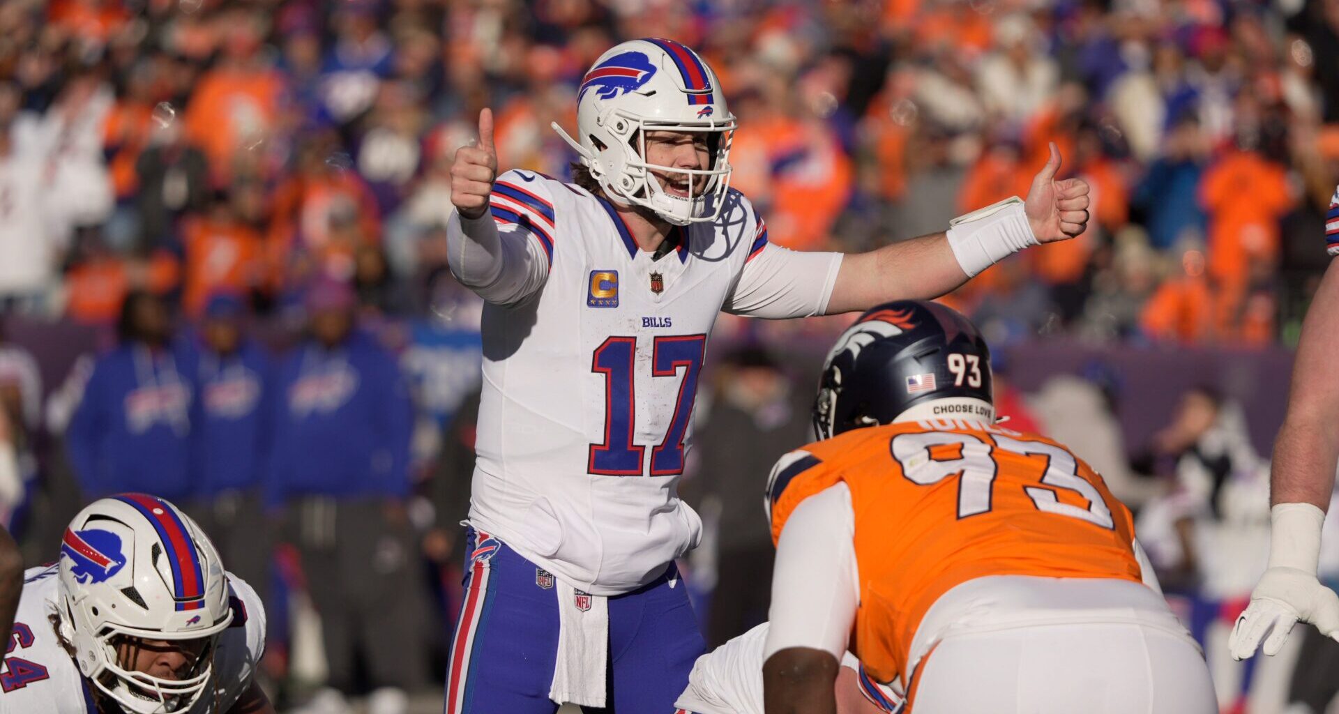 Buffalo Bills quarterback Josh Allen signals to the offensive line a play during first half action at Empower FIeld at Mile High