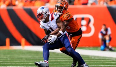 Sep 8, 2024; Cincinnati, Ohio, USA; Cincinnati Bengals cornerback Dax Hill (23) brings down New England Patriots wide receiver Ja'Lynn Polk (1) in the second half at Paycor Stadium.