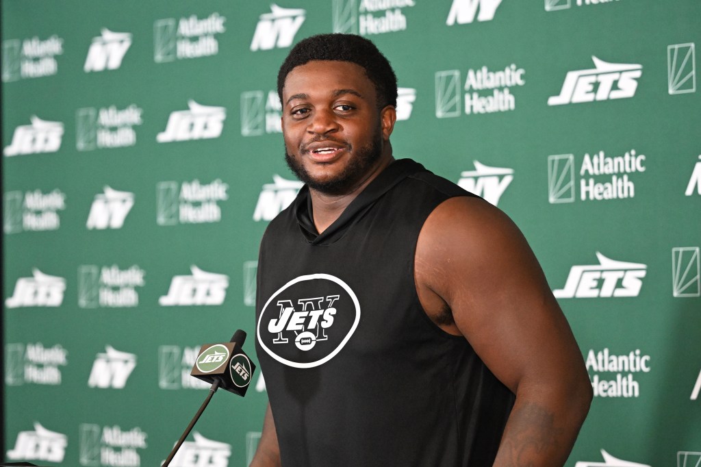 Jets player Armand Membou speaks to the media at a press conference.