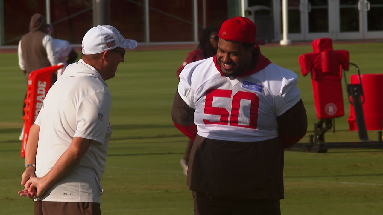 Tampa Bay Buccaneers defensive tackle Vita Vea (50) talks with general manager Jason Licht during training camp practice at the AdventHealth Training Center on August 20, 2026. (Spectrum News/Michael Epps)