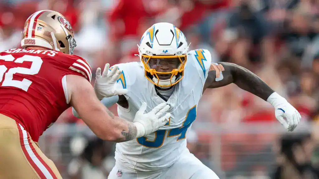 Los Angeles Chargers former outside linebacker Kyle Kennard extending his arm to engage a San Francisco 49ers offensive tackle during a regular season game.