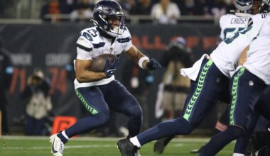 Dec 26, 2024; Chicago, Illinois, USA; Seattle Seahawks running back Kenny McIntosh (25) runs for a gain during the first quarter against the Chicago Bears at Soldier Field.