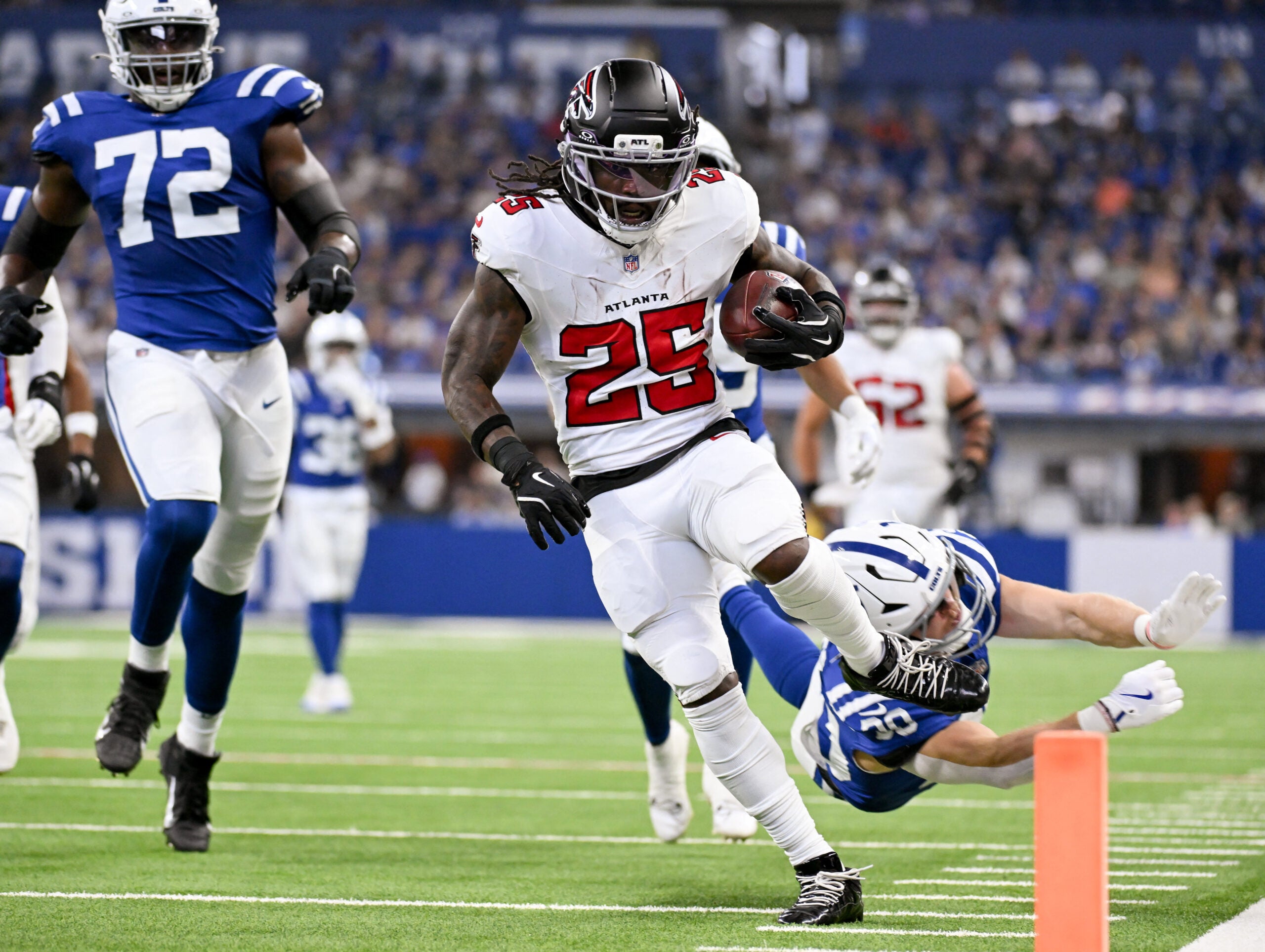 Aug 22, 2026; Indianapolis, Indiana, USA; Atlanta Falcons running back Tyler Goodson (25) runs for a touchdown against the Indianapolis Colts during the first half at Lucas Oil Stadium.