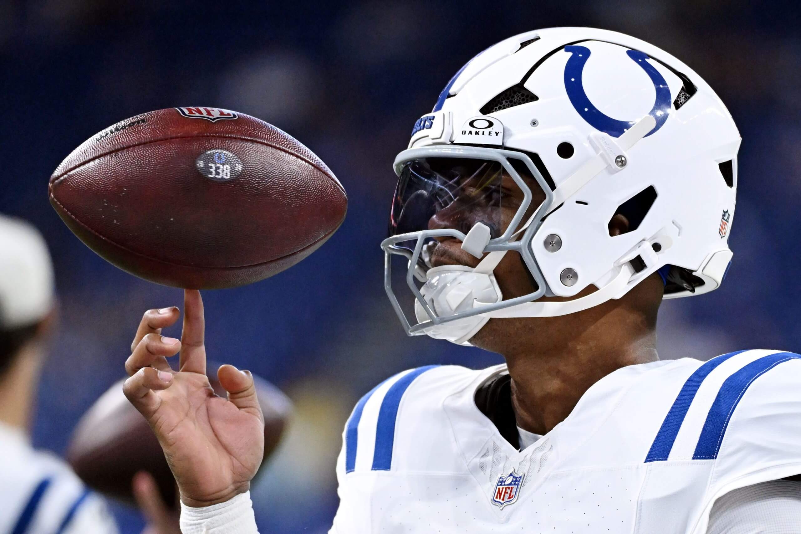 Indianapolis Colts quarterback Anthony Richardson Sr. keeps a football on one fingertip of his right hand.