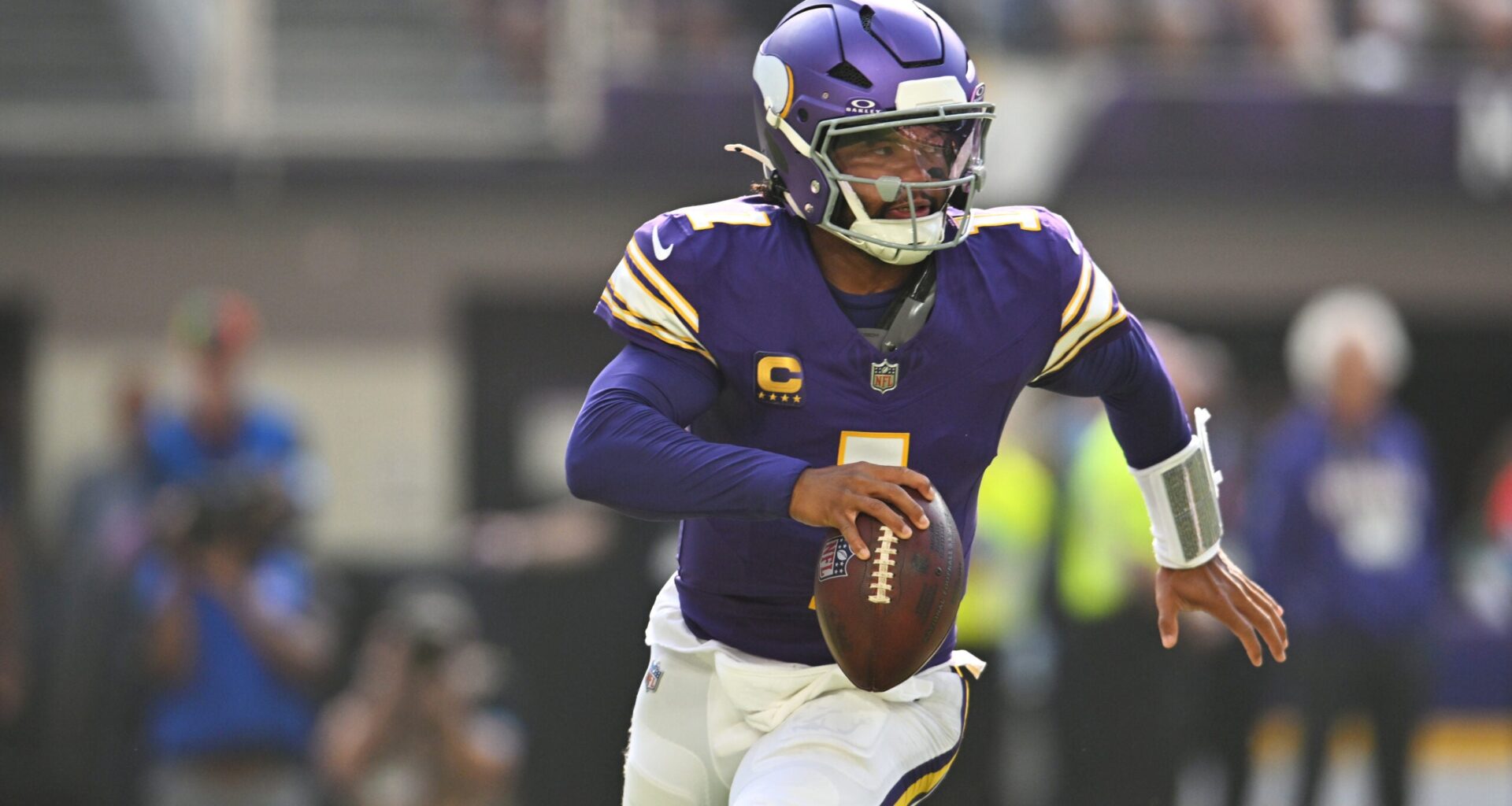 Sep 13, 2026; Minneapolis, Minnesota, USA; Minnesota Vikings quarterback Kyler Murray (1) runs the ball against the Green Bay Packers during the first half at U.S. Bank Stadium.