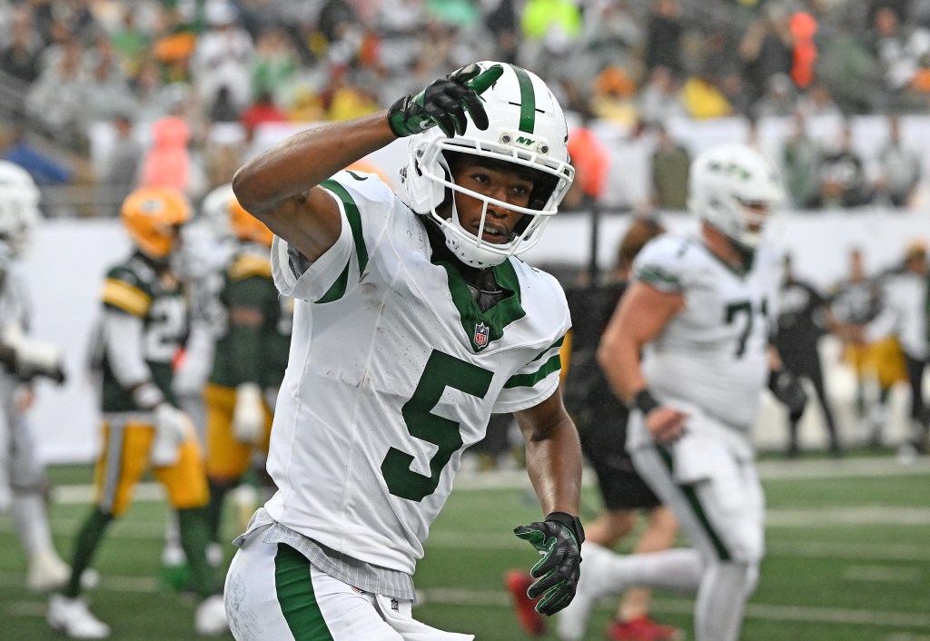 New York Jets wide receiver Garrett Wilson (5) reacts after scoring a touchdown.
