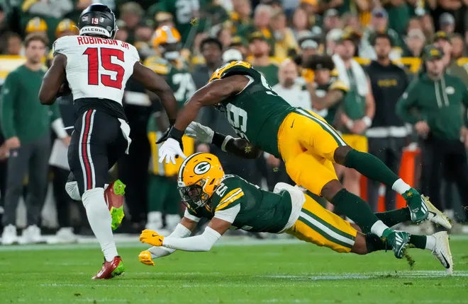Green Bay Packers cornerback Brandon Cisse (2) and defensive end Barryn Sorrell (99) miss a tackle against Atlanta Falcons running back Brian Robinson Jr. (15) on Thursday, Sept. 24, 2026, at Lambeau Field in Green Bay, Wisconsin.
Tork Mason/Green Bay Press-Gazette