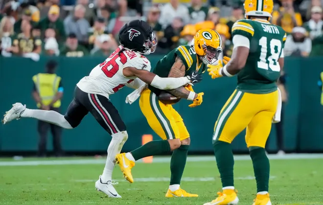 wide receiver Christian Watson (9) catches a pass against Atlanta Falcons cornerback C.J. Henderson (26) on Thursday, Sept. 24, 2026, at Lambeau Field in Green Bay, Wisconsin. The Falcons won the game, 35-14.
Tork Mason/Green Bay Press-Gazette