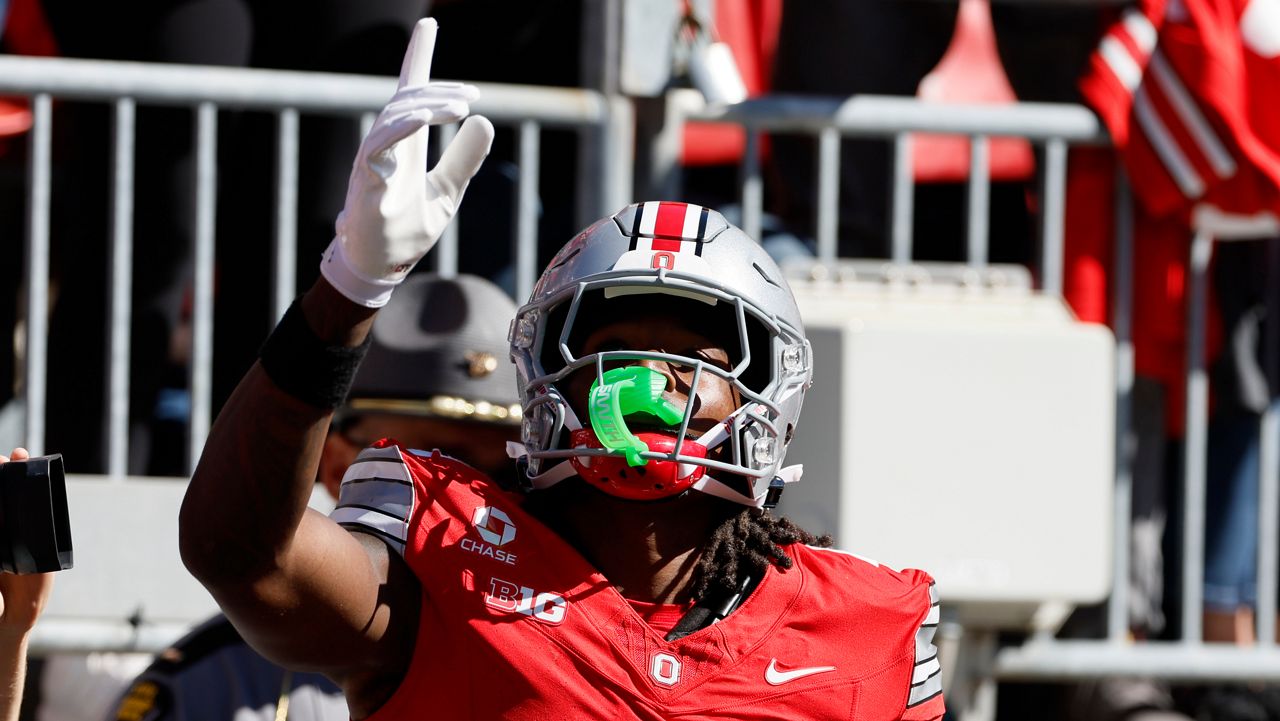 Ohio State wide receiver Jeremiah Smith celebrates his touchdown against Illinois during the second half of an NCAA college football game, Saturday, Sept. 26, 2026, in Columbus, Ohio. (AP Photo/Jay LaPrete)