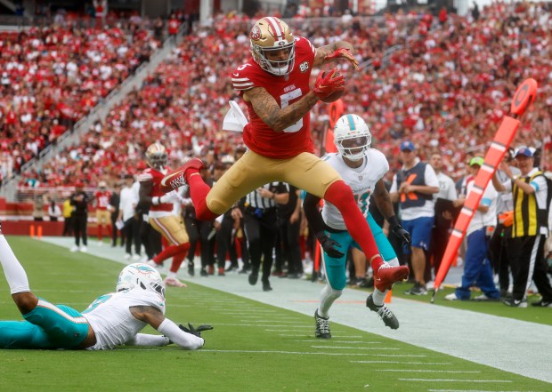 San Francisco 49ers' Mike Evans (5) leaps for extra yards after a catch inside the 10-yard line against the Miami Dolphins in the third quarter at Levi's Stadium in Santa Clara, Calif., on Sunday, Sept. 20, 2026. (Nhat V. Meyer/Bay Area News Group)