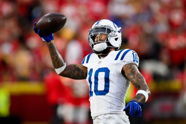 Indianapolis Colts wide receiver Keenan Allen makes a catch during warmups before an NFL football game against the Kansas City Chiefs in Kansas City, Mo., Sunday, Sept. 20, 2026. (AP Photo/Reed Hoffmann)