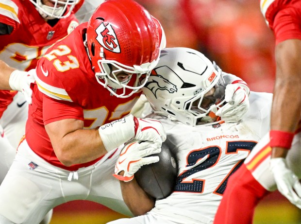 Drue Tranquill (23) of the Kansas City Chiefs brings down J.K. Dobbins (27) of the Denver Broncos during the first quarter at Arrowhead Stadium in Kansas City, Missouri on Monday, September 14, 2026. (Photo by AAron Ontiveroz/The Denver Post)