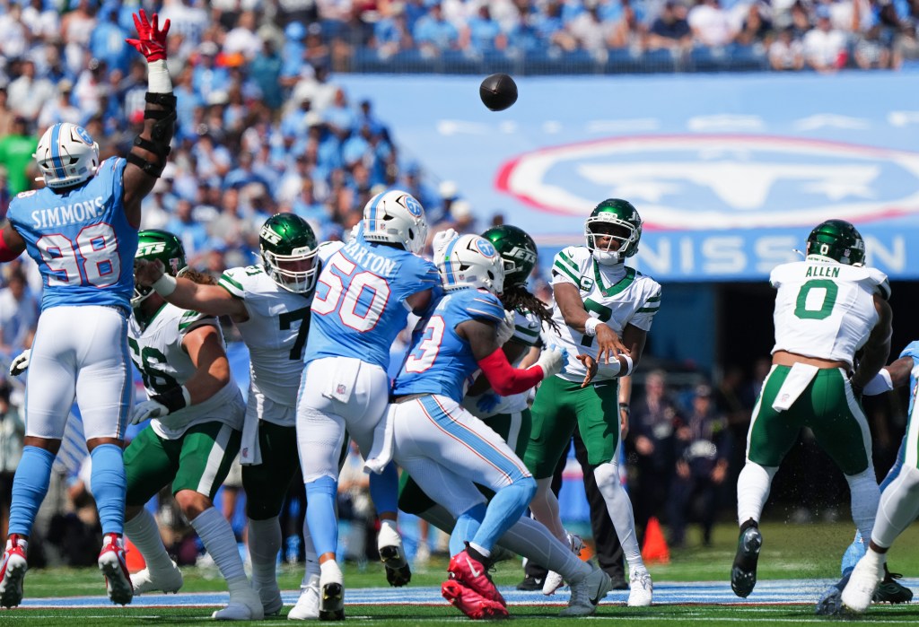 Geno Smith of the New York Jets throws a pass against the Tennessee Titans.