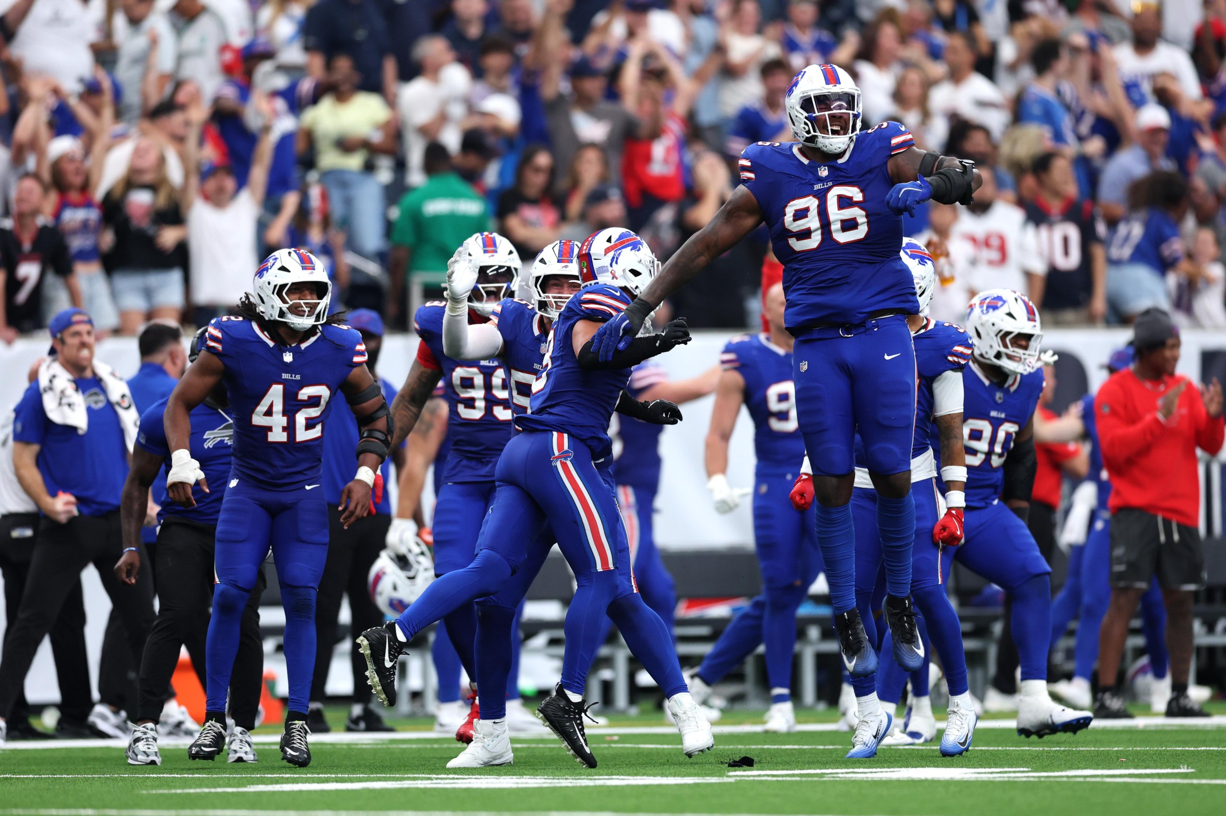 HOUSTON, TEXAS - SEPTEMBER 13: Deone Walker #96 of the Buffalo Bills celebrates with teammates after fumble during the fourth quarter of the game against the Houston Texans at NRG Stadium on September 13, 2026 in Houston, Texas. (Photo by Tim Warner/Getty Images)