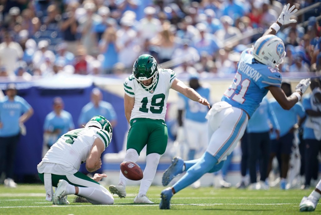 New York Jets place kicker Jason Sanders (19) kicking a field goal.