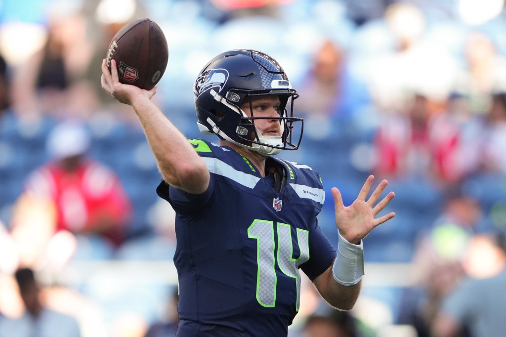 Seattle Seahawks quarterback Sam Darnold throws a pass during warmups.