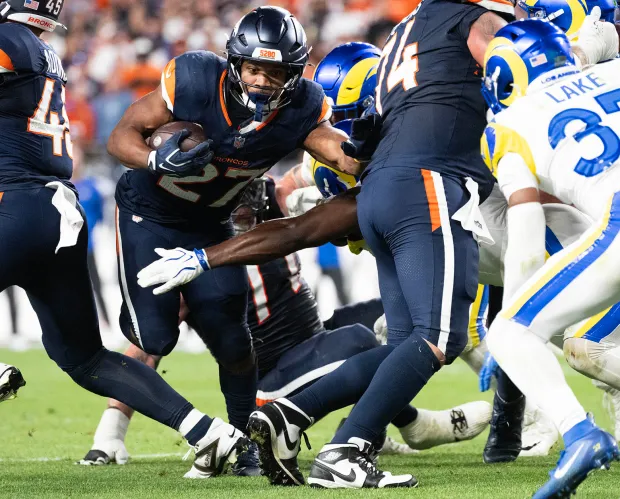 Denver Broncos running back J.K. Dobbins (27) runs down field against the Los Angeles Rams Sunday, Sept. 27, 2026, during the second half at Empower Field at Mile High in Denver. The Broncos won 30-26. (Christian Murdock, The Gazette)