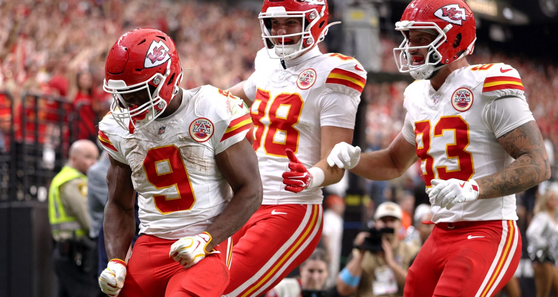 Oct 4, 2026; Paradise, Nevada, USA; Kansas City Chiefs running back Kenneth Walker III (9) celebrates with tight ends Jake Briningstool (88) and Noah Gray (83) after scoring a touchdown against the Las Vegas Raiders during the fourth quarter at Allegiant Stadium.