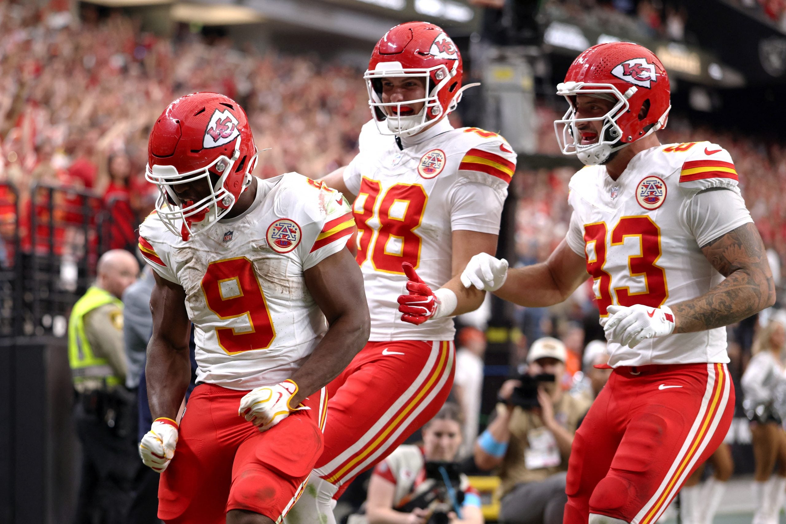 Oct 4, 2026; Paradise, Nevada, USA; Kansas City Chiefs running back Kenneth Walker III (9) celebrates with tight ends Jake Briningstool (88) and Noah Gray (83) after scoring a touchdown against the Las Vegas Raiders during the fourth quarter at Allegiant Stadium.