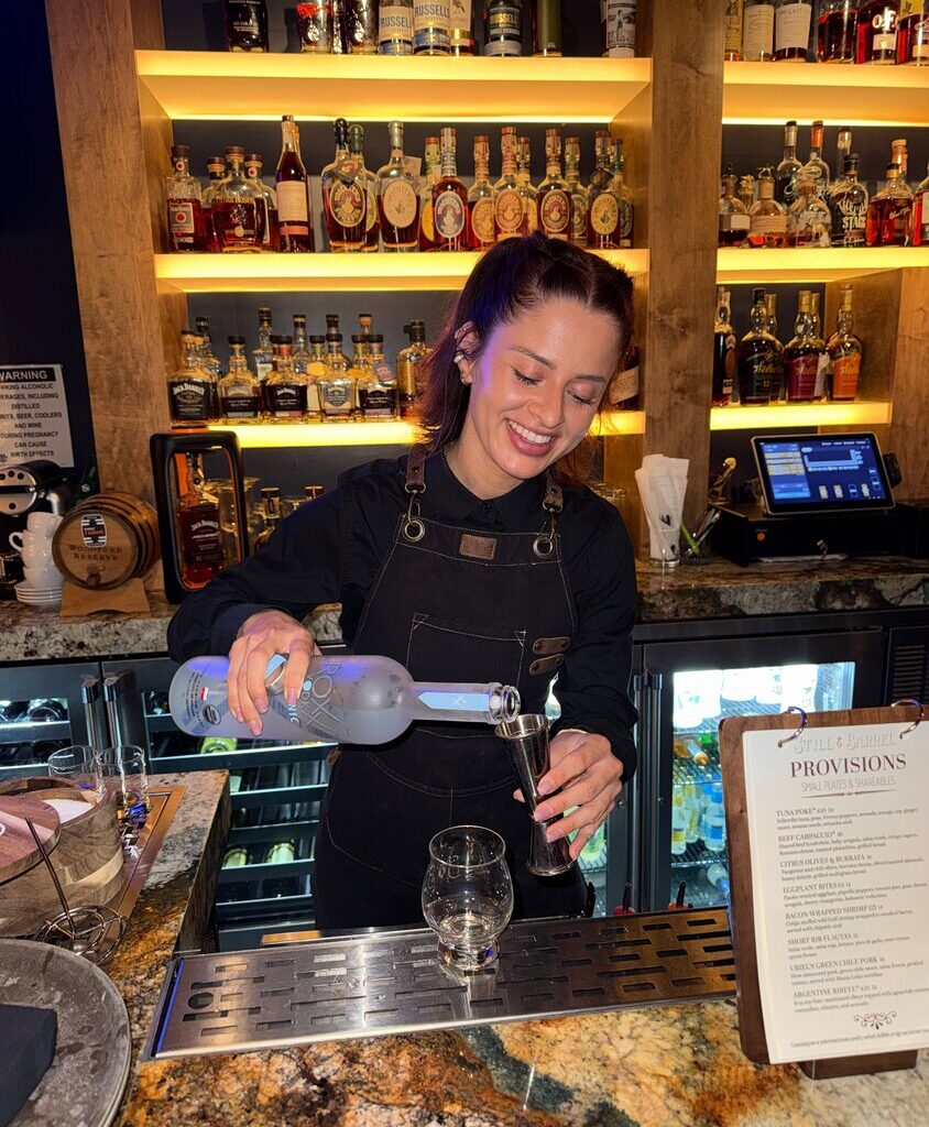 Mixologist Azalea Barr pours ROXX Vodka into a shaker while preparing the Cardinals Gold at Still & Barrel in Phoenix. Barr, who grew up in Goodyear, created the Arizona-inspired cocktail through a competition held by ROXX Vodka.