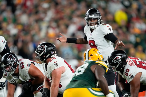 Michael Penix Jr. #9 of the Atlanta Falcons stands at the line of scrimmage against the Green Bay Packers in the third quarter at Lambeau Field on September 24, 2026 in Green Bay, Wisconsin. (Photo by Patrick McDermott/Getty Images)