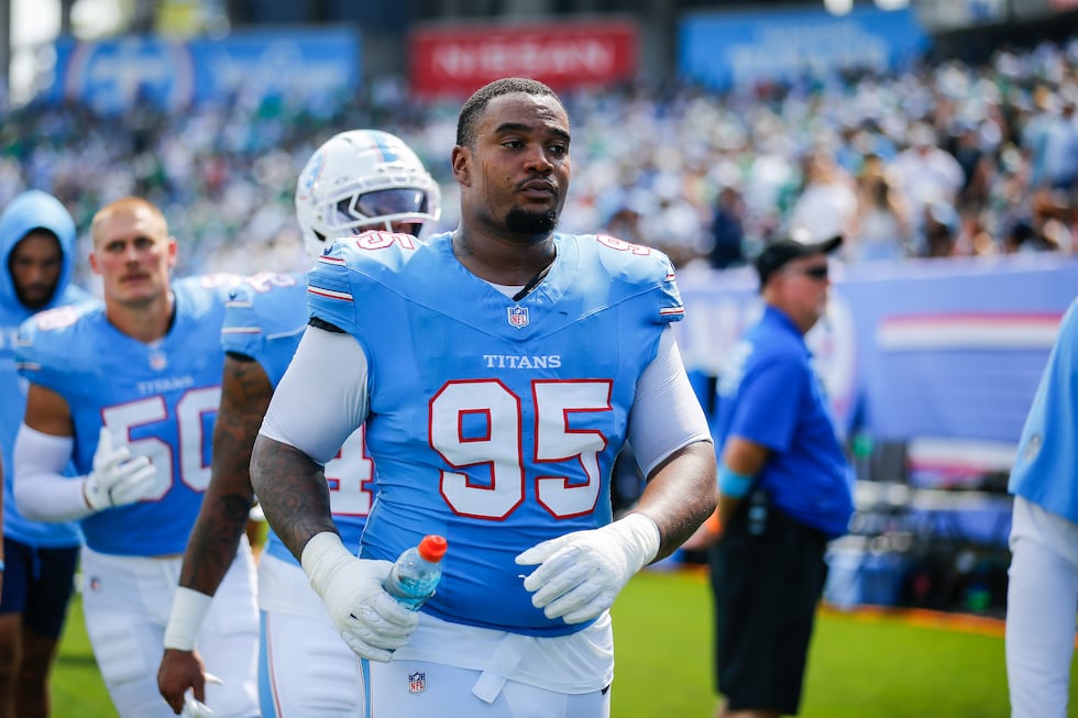 Tennessee Titans defensive lineman Jordan Elliott (95) walks to the locker room at halftime of...