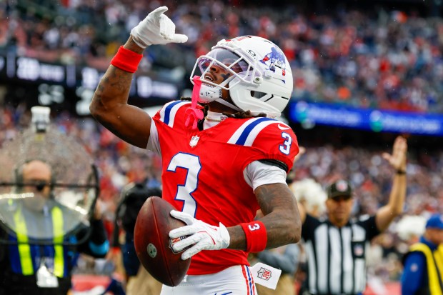 New England Patriots wide receiver DeMario Douglas (3) reacts after scoring a touchdown during the second half of an NFL football game against the Las Vegas Raiders in Foxborough, Mass., Sunday, Oct. 11, 2026. (AP Photo/Greg M. Cooper)