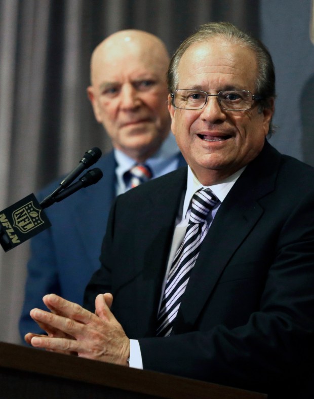 Houston Texans owner Bob McNair, left, listens as San Diego Chargers owner Dean Spanos talks to the media after team owners voted in January 2016 to allow the St. Louis Rams to move to a new stadium just outside Los Angeles. The Chargers will have an option to share the facility. (AP Photo/Pat Sullivan)